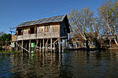 Inle Lake Myanmar. All the buildings are constructed on piles. Residents travel around by canoe, but there are also bamboo walkways and bridges over the canals, monasteries and stupas. 